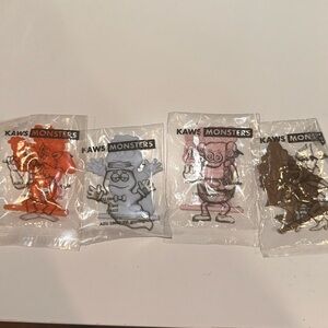 KAWS X MONSTERS CEREAL SET OF FOUR CEREAL FIGURINES